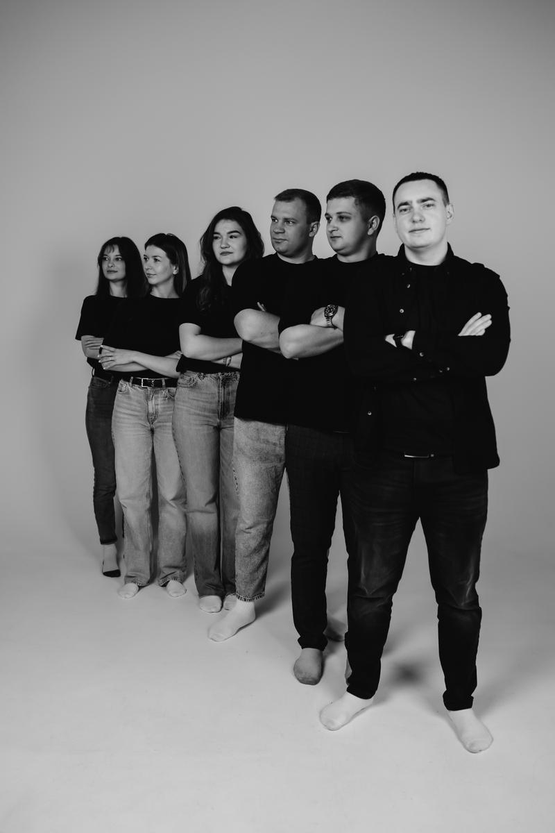 Team lined up in black and white